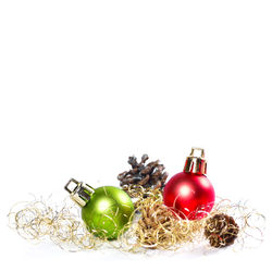 Close-up of christmas decorations over white background