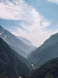 Scenic view of mountains against sky at sunset