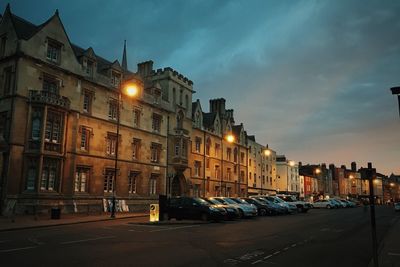 Cars parked on sidewalk in front of building