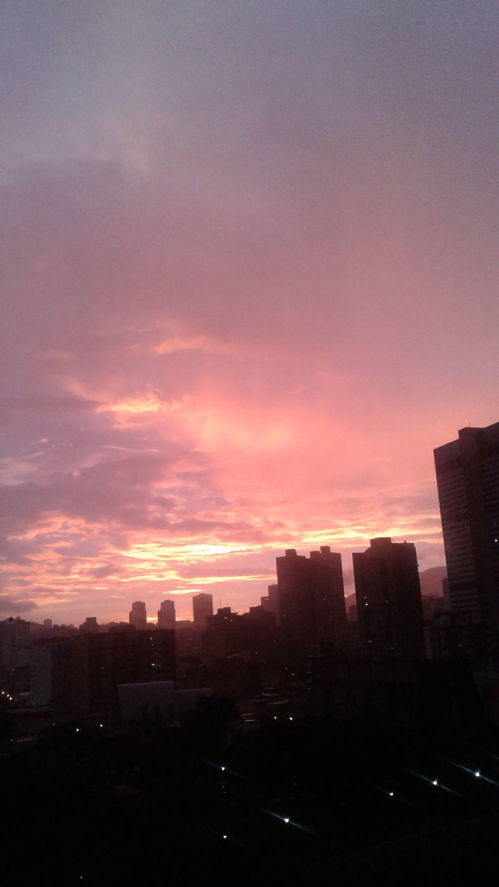 CITYSCAPE AGAINST SKY AT SUNSET