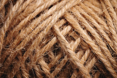 Natural rope twine textured background close up plan. fibers in a mess rustic style