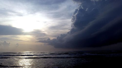 Scenic view of sea against cloudy sky