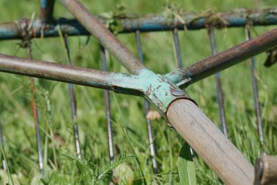 Close-up of wooden fence on field