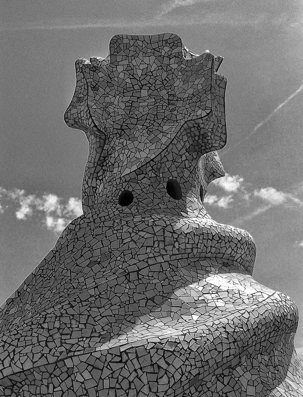 CLOSE-UP OF SCULPTURE AGAINST SKY