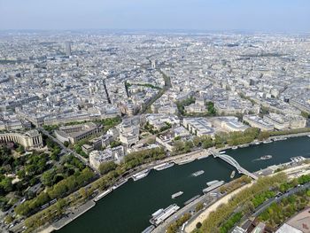 High angle view of river and buildings in city