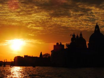 Silhouette of building at sunset