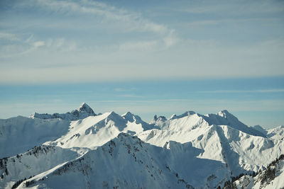 Scenic view of snowcapped mountains against sky