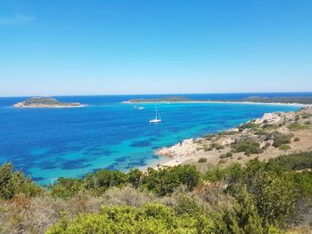 Scenic view of sea against clear blue sky