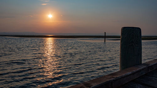 Scenic view of sea against sky at sunrise in grado pineta, italy.