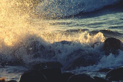 Sea waves splashing on rocks