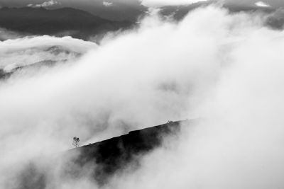 Scenic view of waterfall against sky