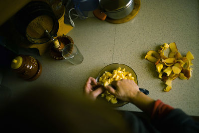 High angle view of person preparing food on table