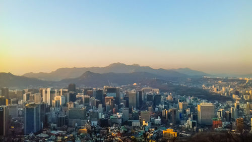 Cityscape against sky during sunset