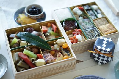 High angle view of various food in boxes on table