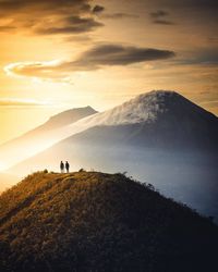 Scenic view of mountains against sky during sunset