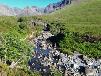 Scenic view of stream flowing through rocks