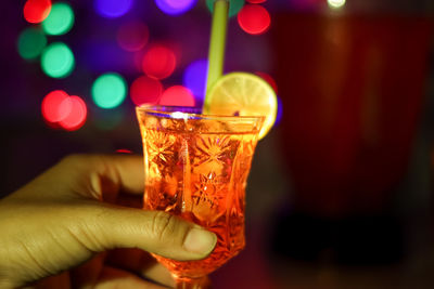 Make cocktail drinks during the holidays and bokeh background