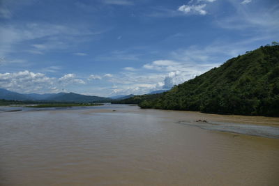 Scenic view of river against sky