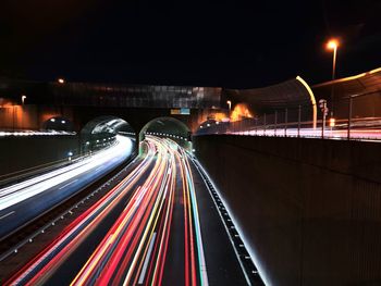 High angle view of light trails on road at night