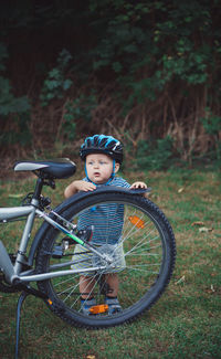 Portrait of boy riding bicycle