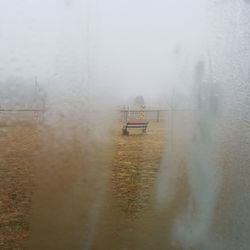 Nautical vessel on field against sky during foggy weather