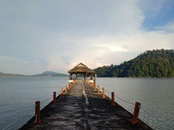 Pier over sea against sky