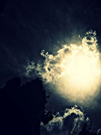 Low angle view of silhouette trees against sky