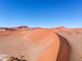 Drone view - red sand dune at sossusvlei near sesriem, namib desert, namibia, africa.