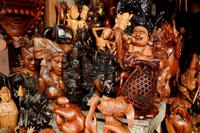 Close-up of statues for sale in market