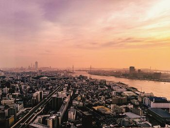 High angle view of city at sunset