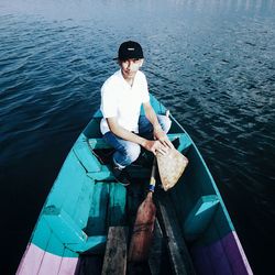 High angle view of young man in boat