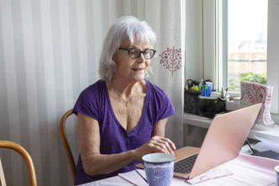 Senior woman using laptop