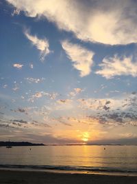 Scenic view of calm sea at sunset