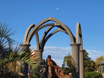 Low angle view of statue against clear blue sky