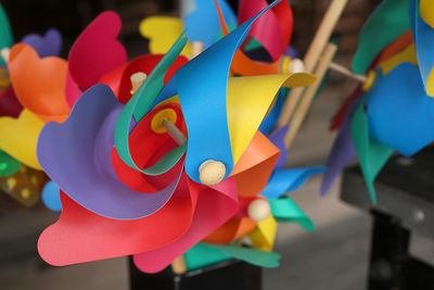 Close-up of multi colored pinwheels for sale at market