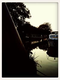 Scenic view of river at sunset