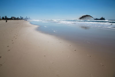 Scenic view of beach against clear sky