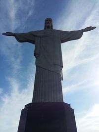 Low angle view of statue against cloudy sky