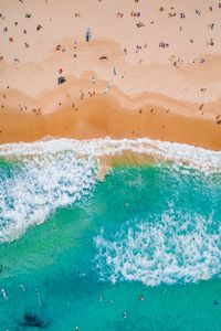 Drone view of people at beach