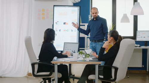 Business colleagues working at office