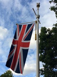 Low angle view of flag against sky