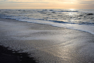 Scenic view of sea at sunset