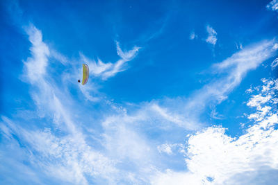 Low angle view of hot air balloon against blue sky