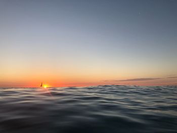 Scenic view of sea against clear sky during sunset