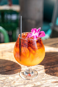 Ice cold mai tai topped with a flower