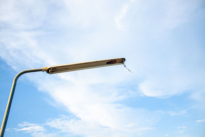 Low angle view of street light against sky