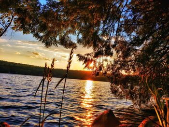 Scenic view of lake against sky during sunset