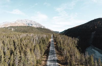 Panoramic view of road leading towards mountain against sky