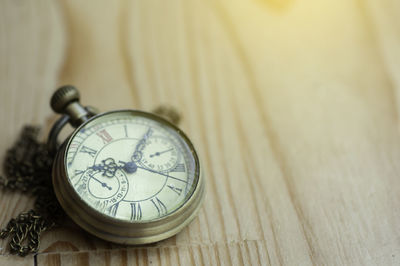 High angle view of clock on table