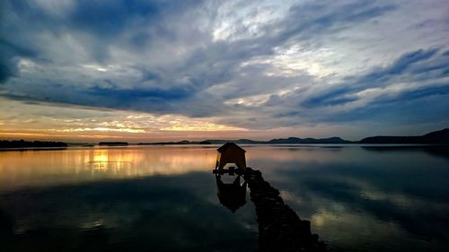 Scenic view of sea against cloudy sky